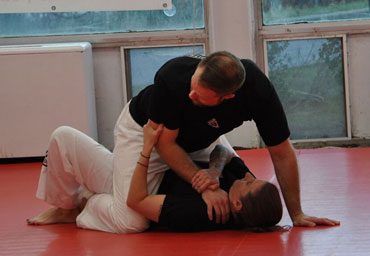 BJJ - Private Lessons Image Man with hand in air